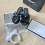 Chanel Bow Embellished Slides In Black - Image 5